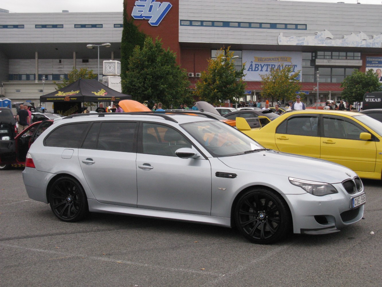 Silver station wagon with black alloy wheels and sporty front design