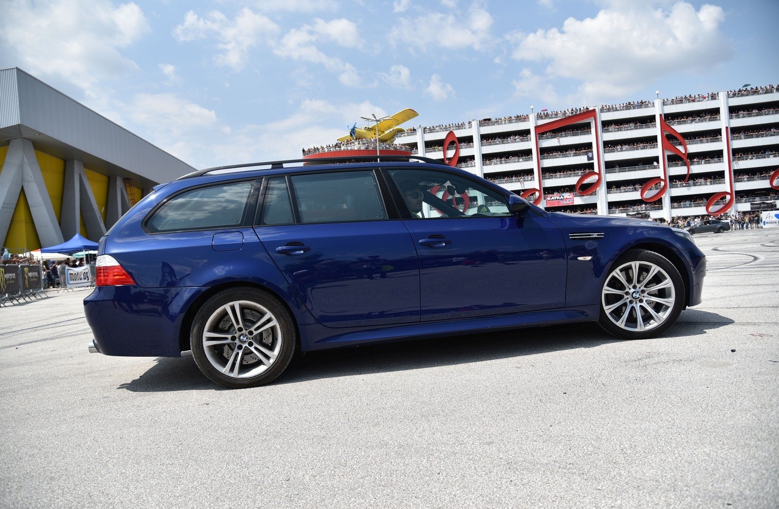 Side profile of a sporty estate with alloy wheels