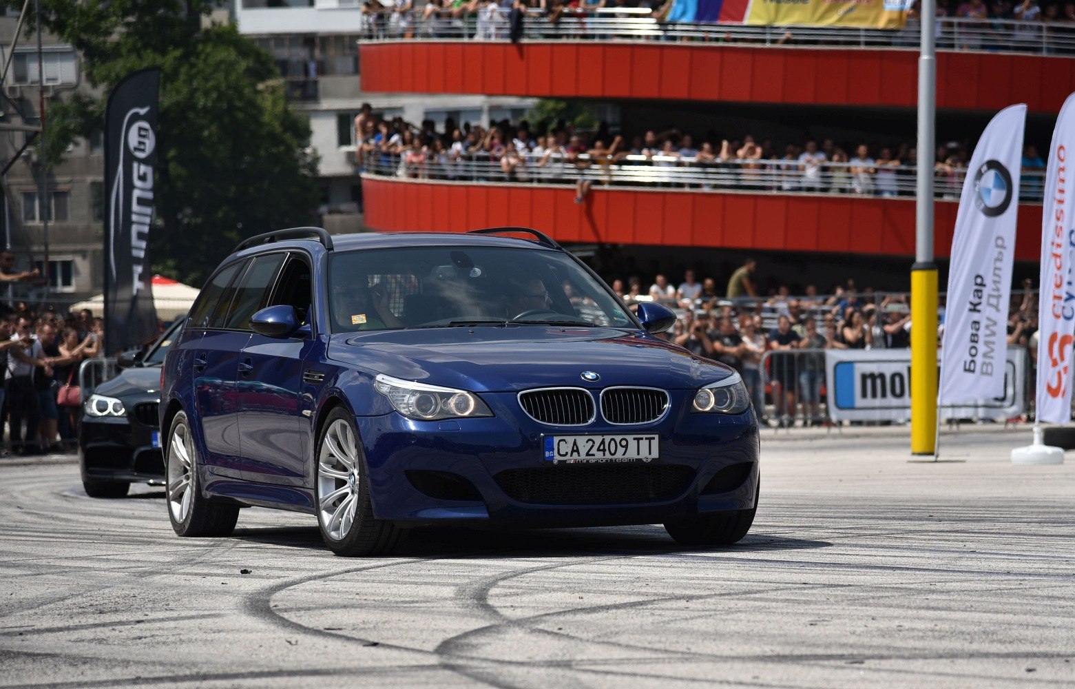 Blue sporty estate with twin kidney grille and distinctive alloy wheels
