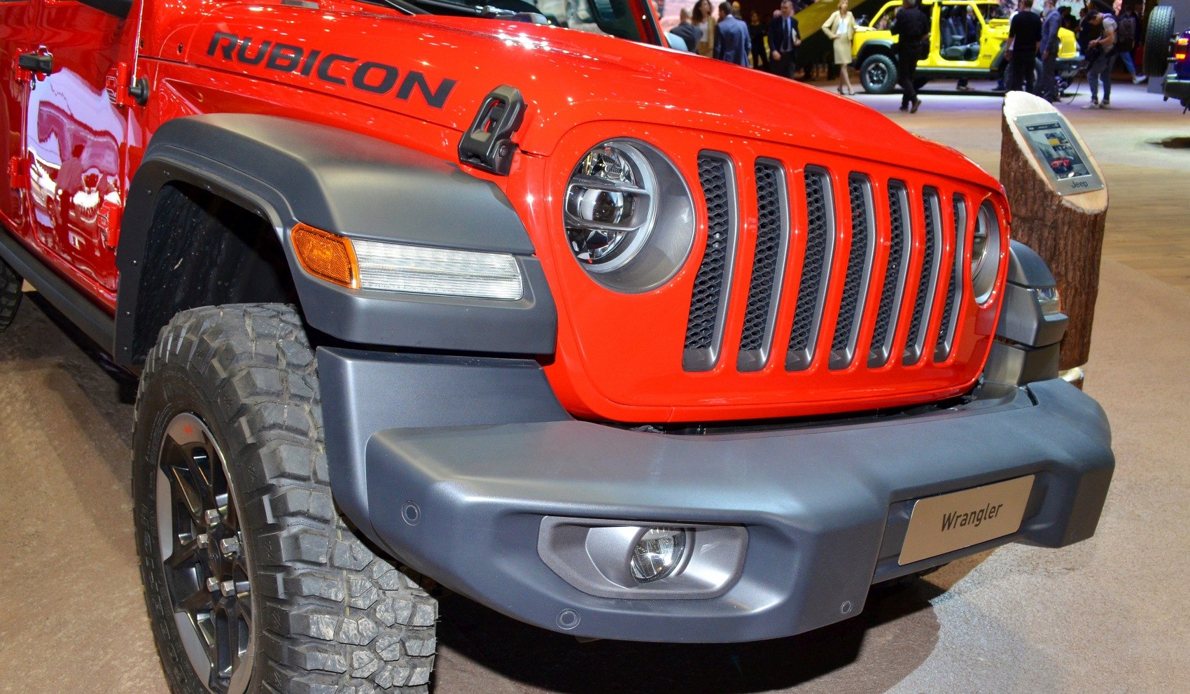 Front close-up with round LED headlights, Rubicon badge, and rugged off-road tires