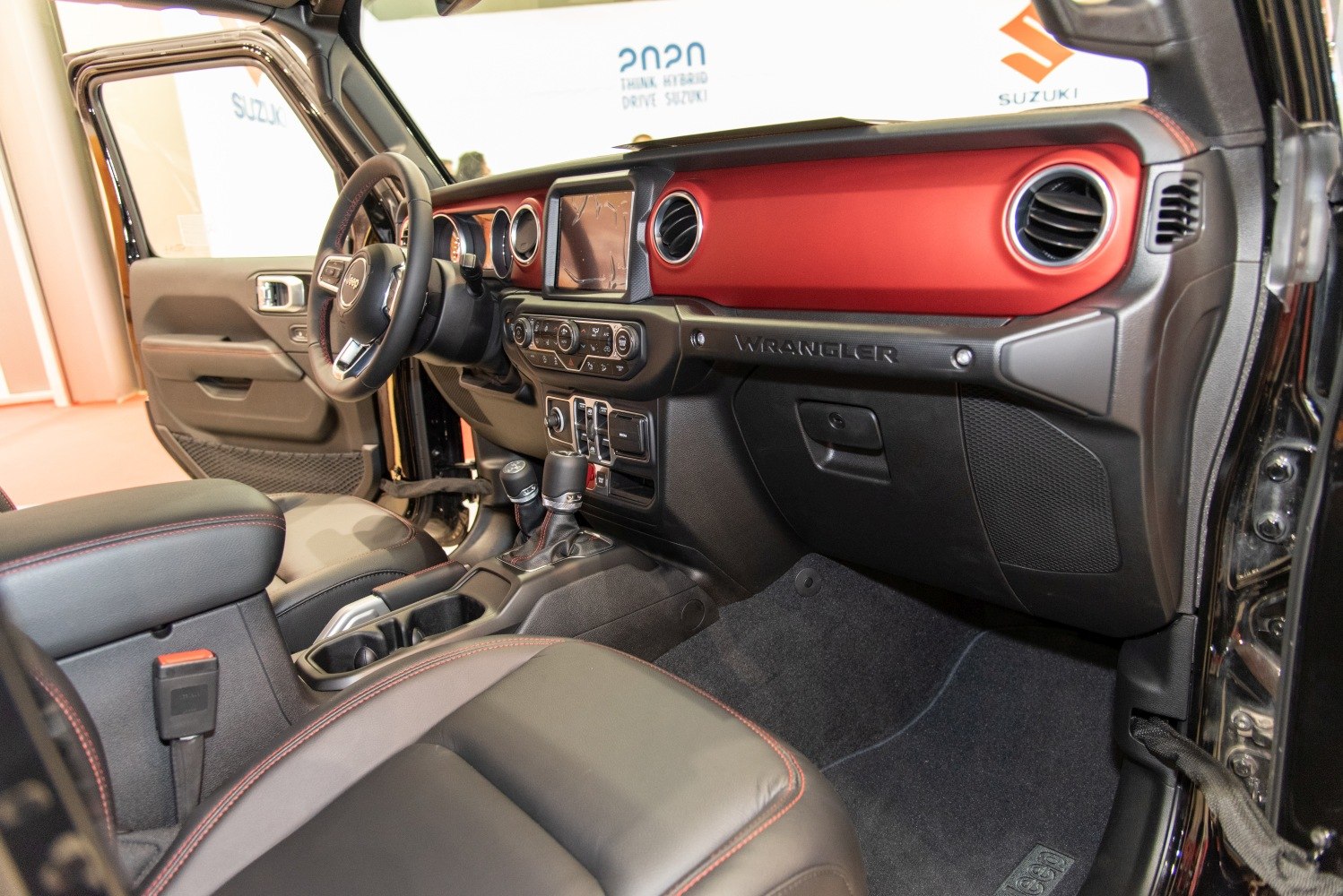 Dashboard and cabin interior with red accent panel and modern controls