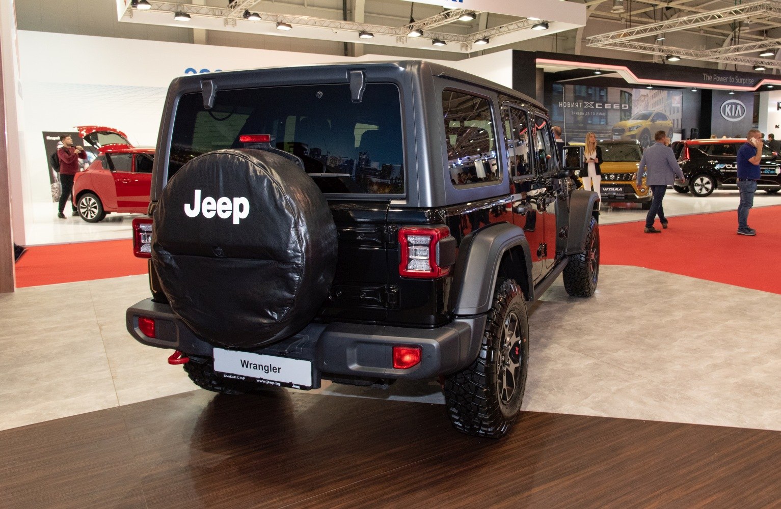 Rear view of an SUV with spare tire cover and off-road tires.