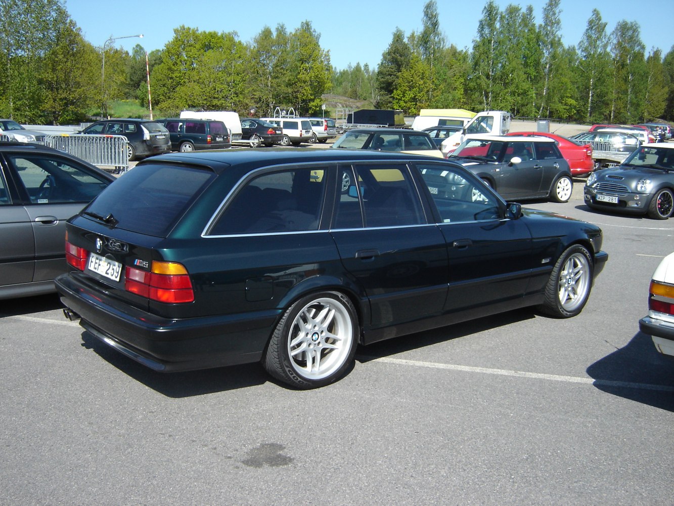 Rear side view of a station wagon with sporty alloy wheels.