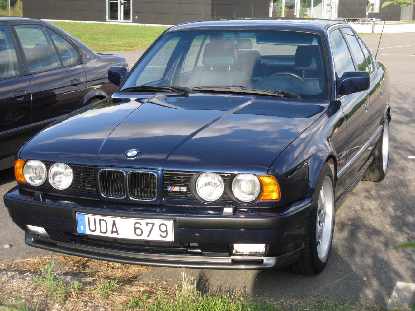 Classic front view with quad round headlights and kidney grille