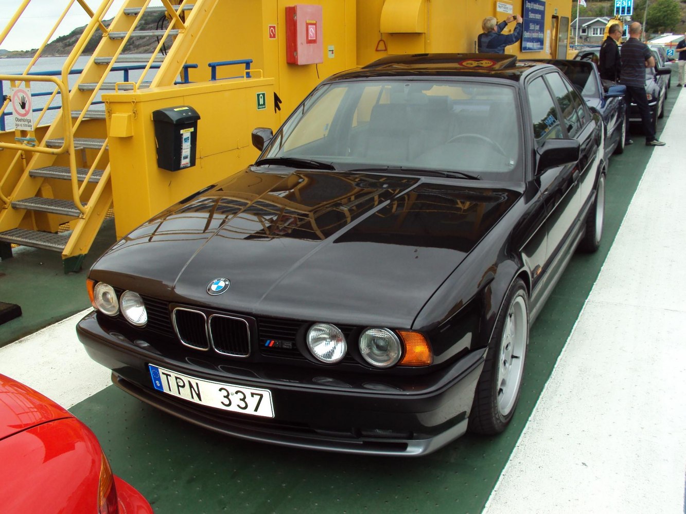 Black classic sedan with quad headlights and kidney grille