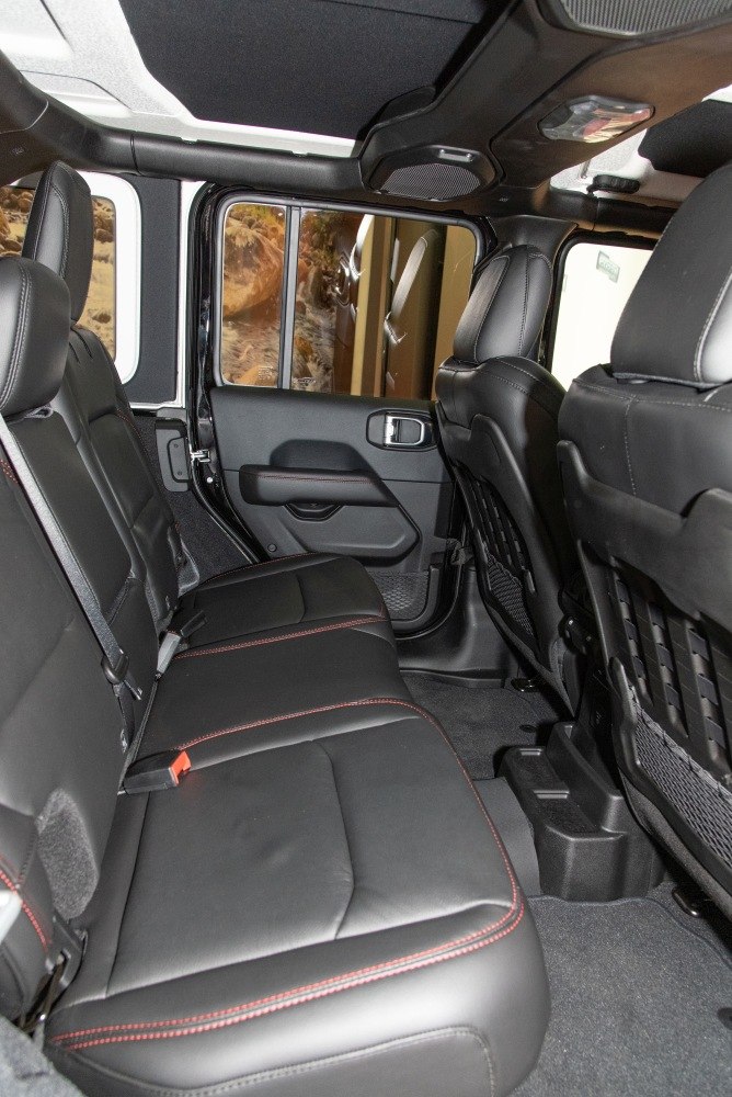 Rear seat interior with black leather and red stitching