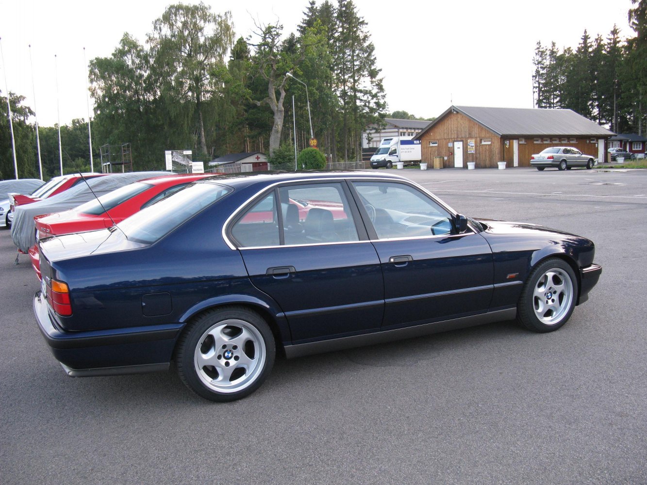 Side profile of classic sedan with distinct alloy wheels