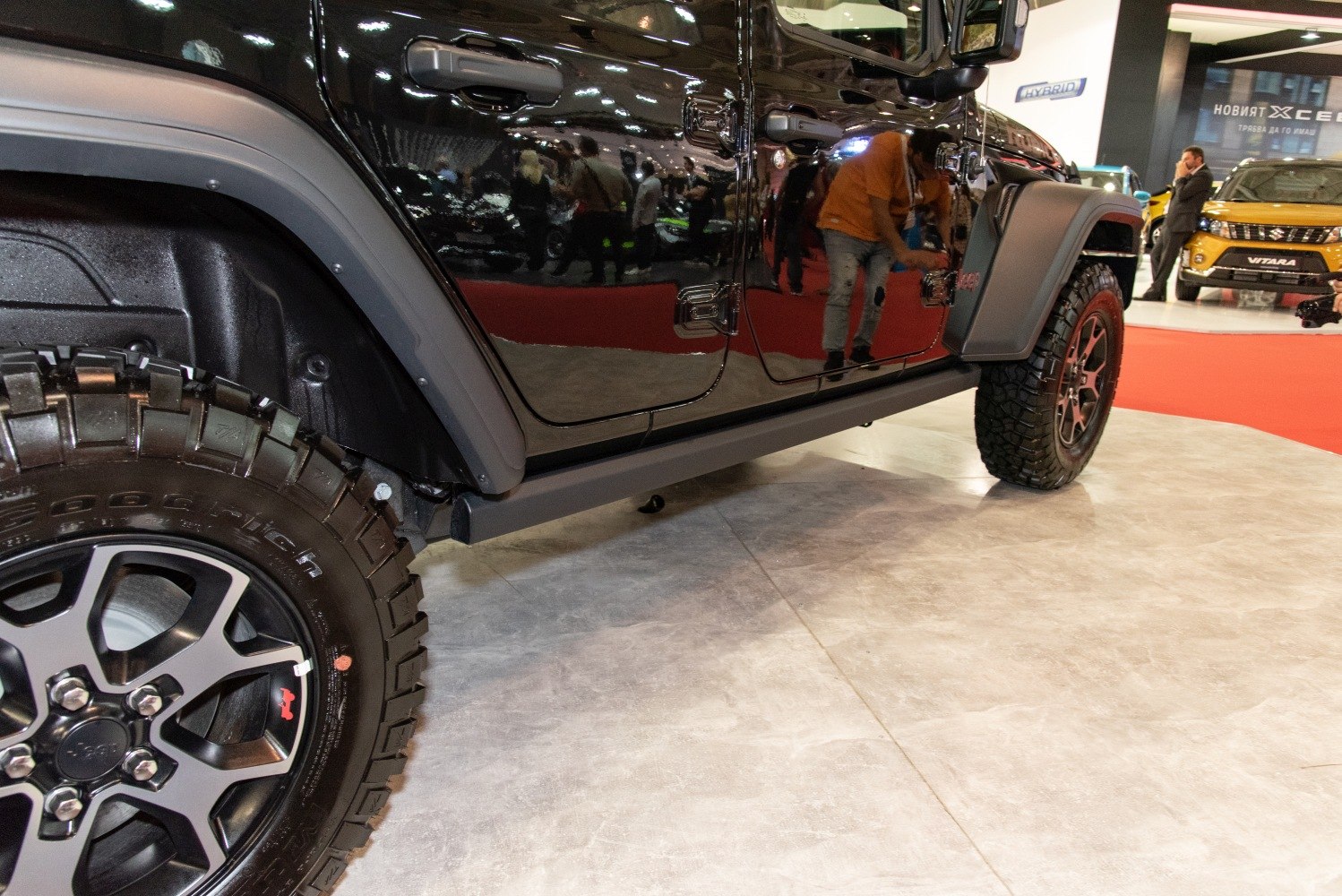 Off-road tire and black side door with reflections
