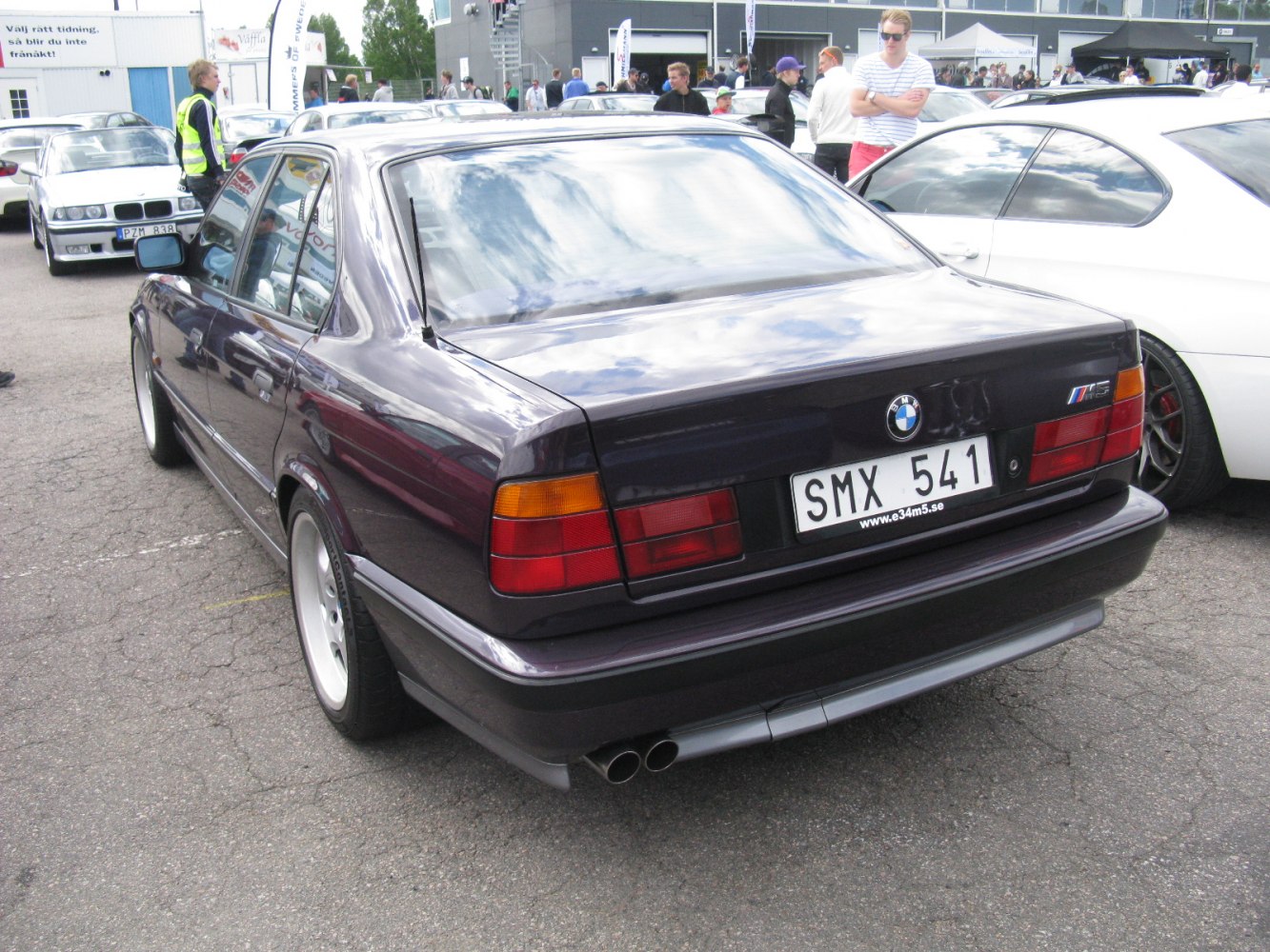 Rear view with iconic taillights and dual exhaust on vintage sedan