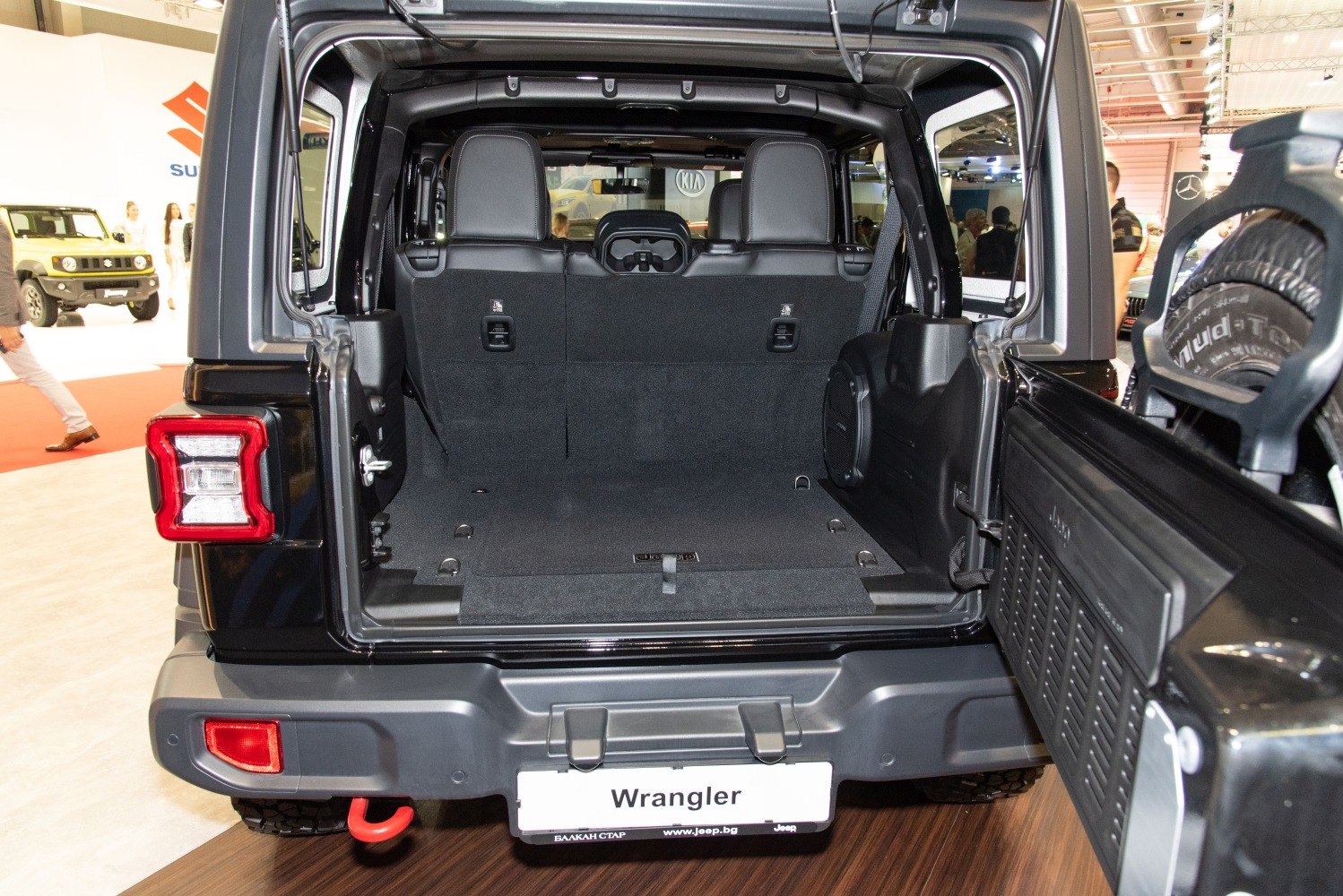 Spacious rear trunk and back seats of an SUV with open tailgate