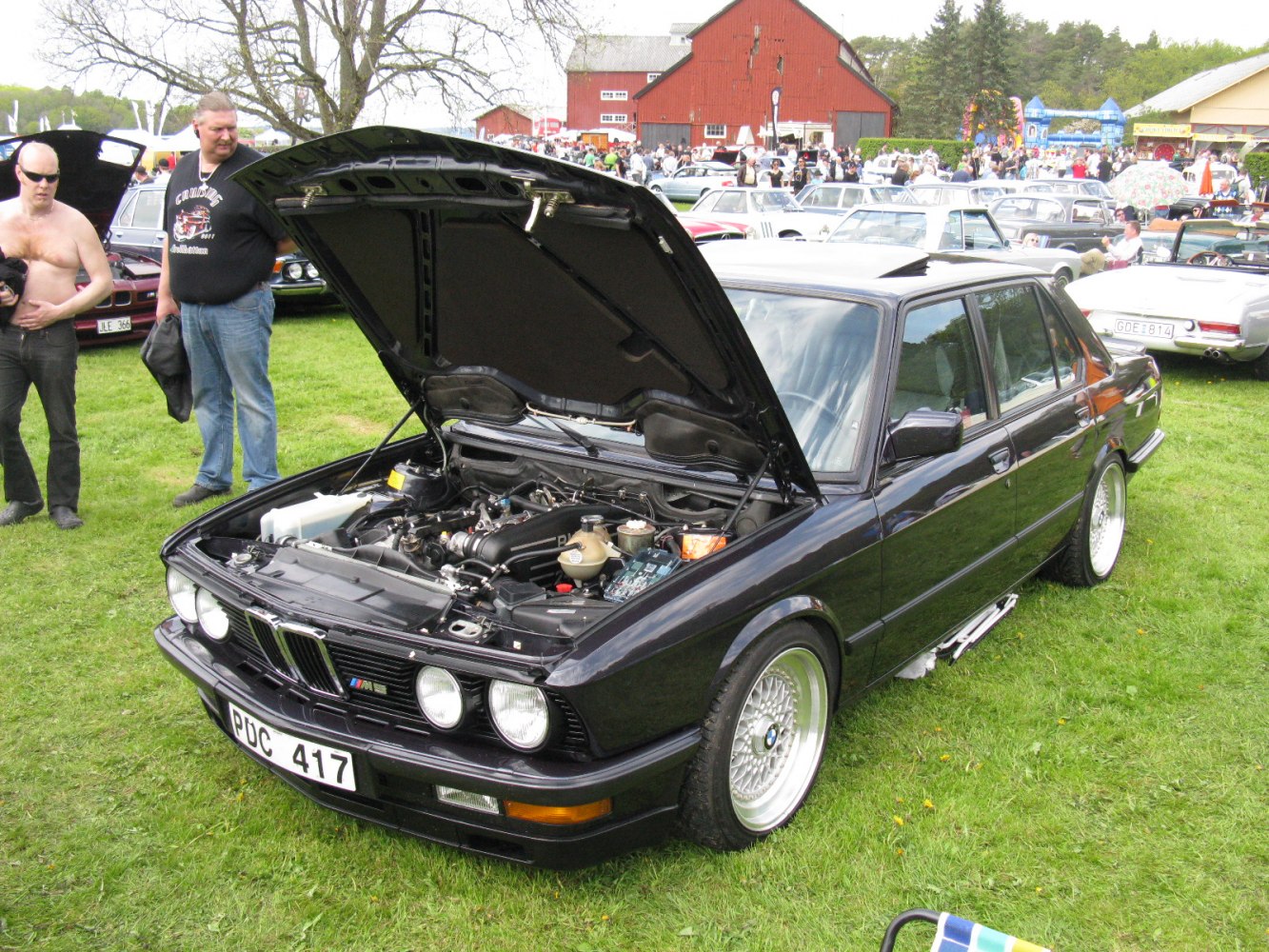 Classic sedan with open hood showing engine compartment