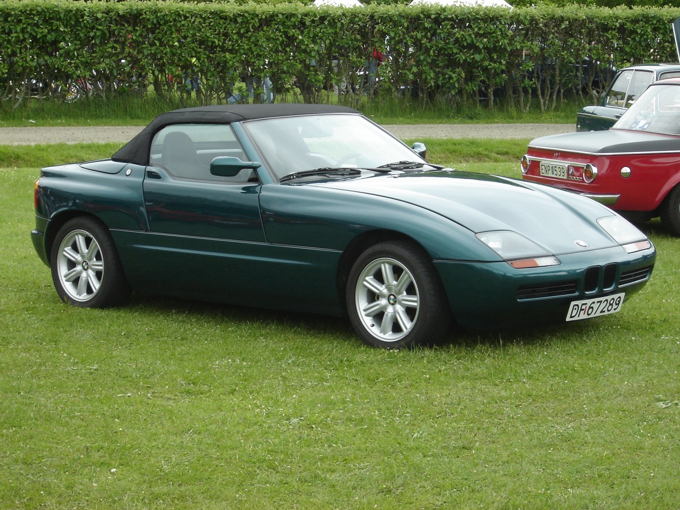 Classic convertible roadster with unique retractable doors and sleek aerodynamic body.