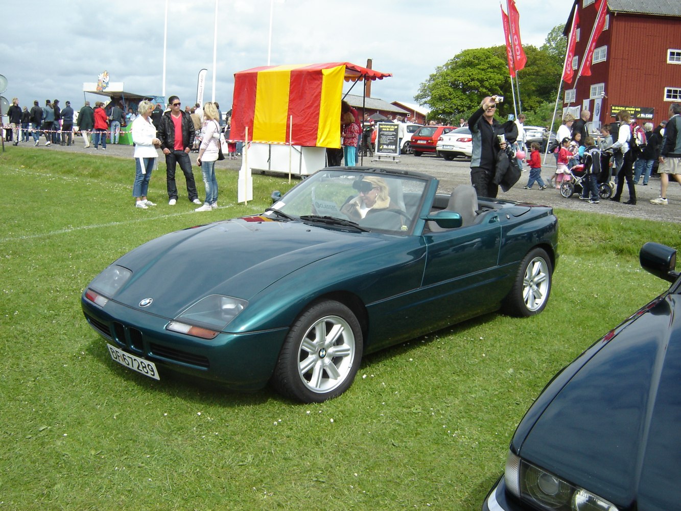 Convertible sports car with unique door design and alloy wheels