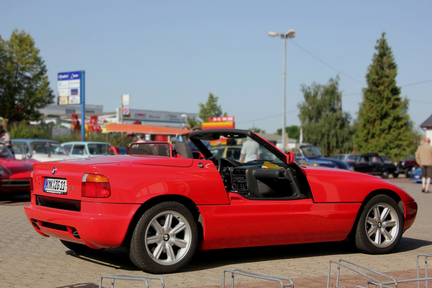 Red convertible with distinctive retractable door and sporty rear design