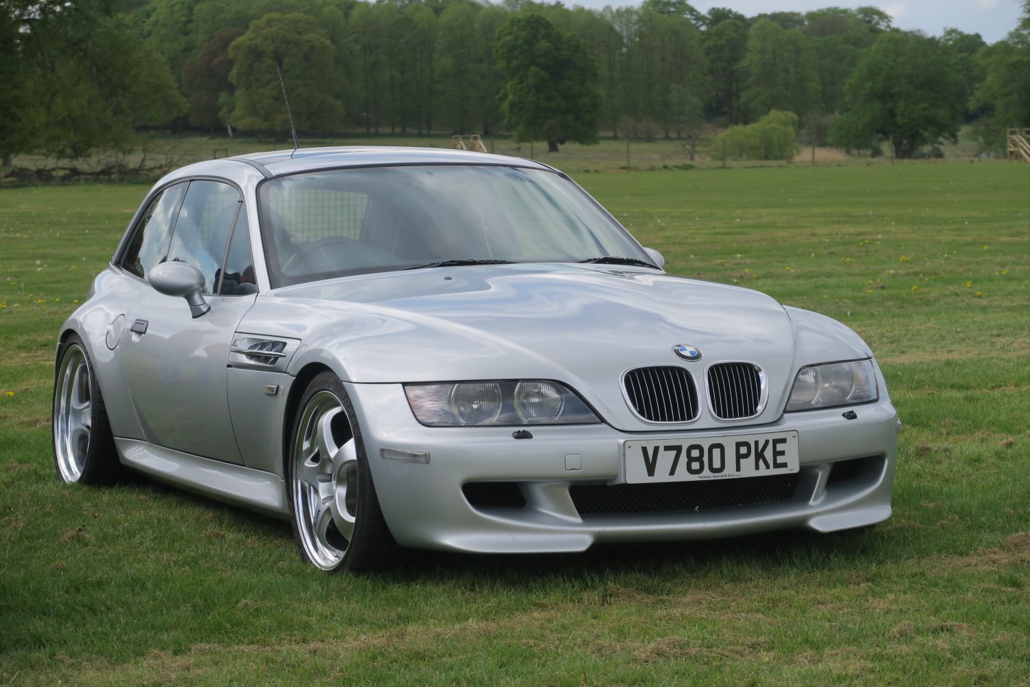 Silver coupe with kidney grille and sporty front design