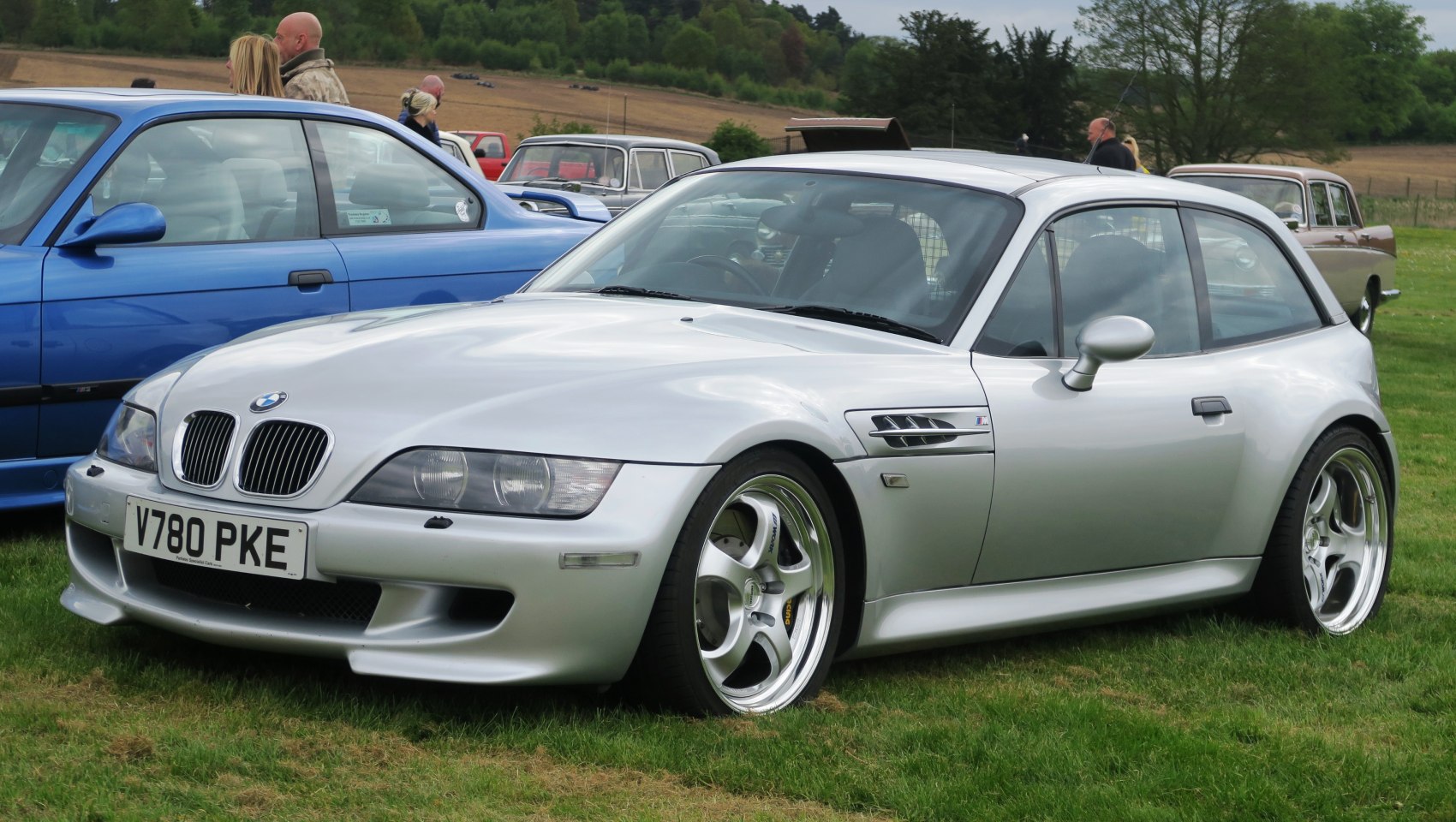 Silver sporty hatchback with muscular lines and five-spoke wheels