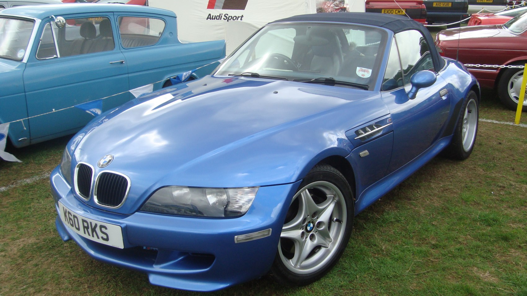 Blue convertible with distinctive front fascia and sporty alloy wheels