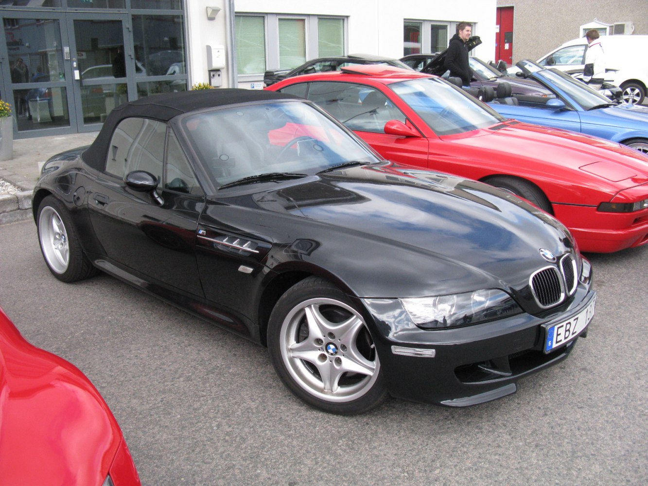 Black convertible with sporty alloy wheels and sleek front design