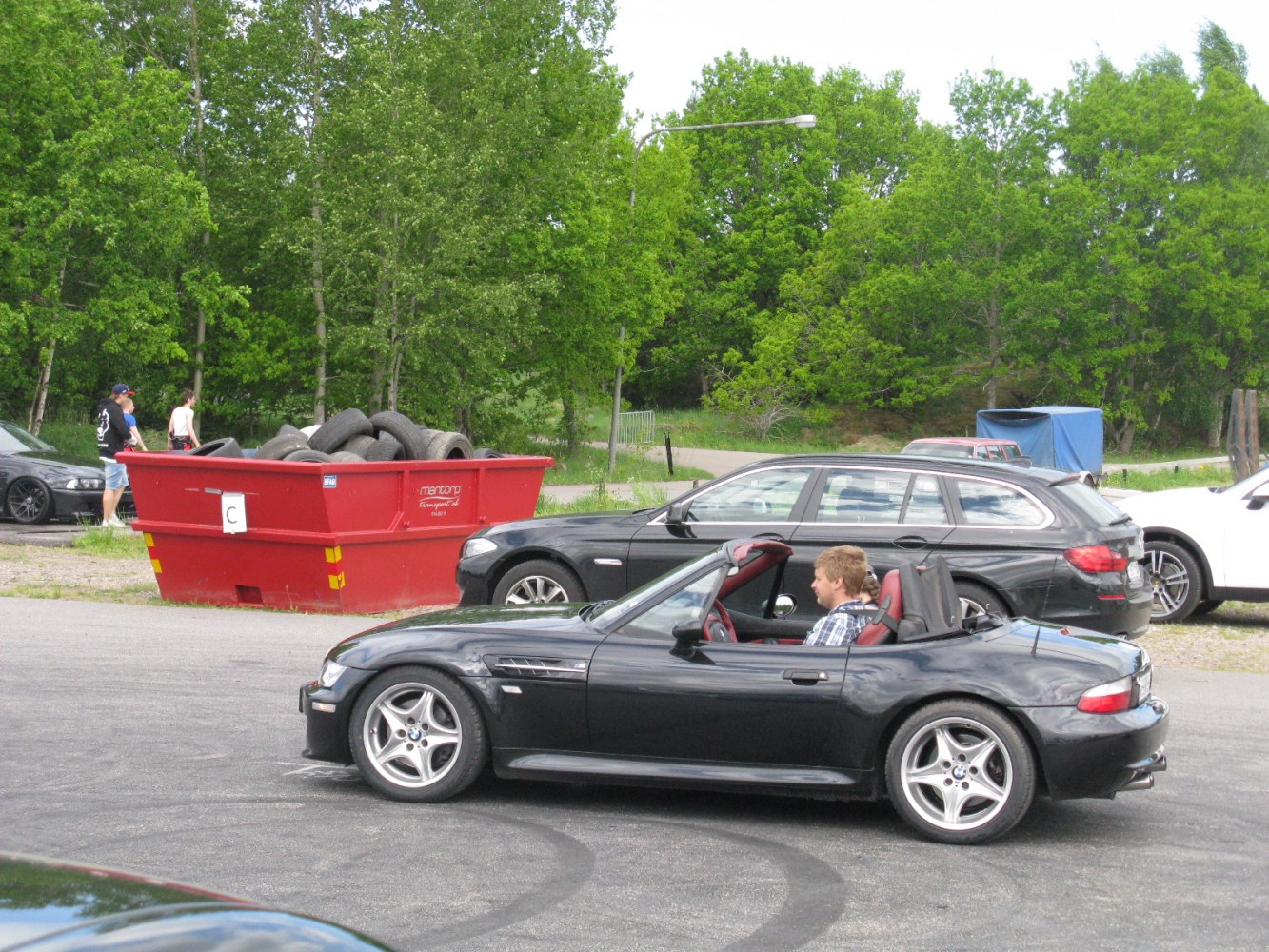 Side view of convertible roadster with open roof and alloy wheels