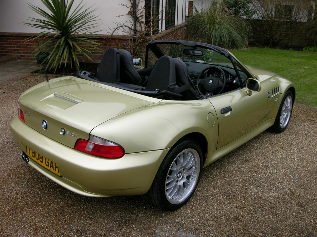 Convertible roadster rear view with visible interior seats