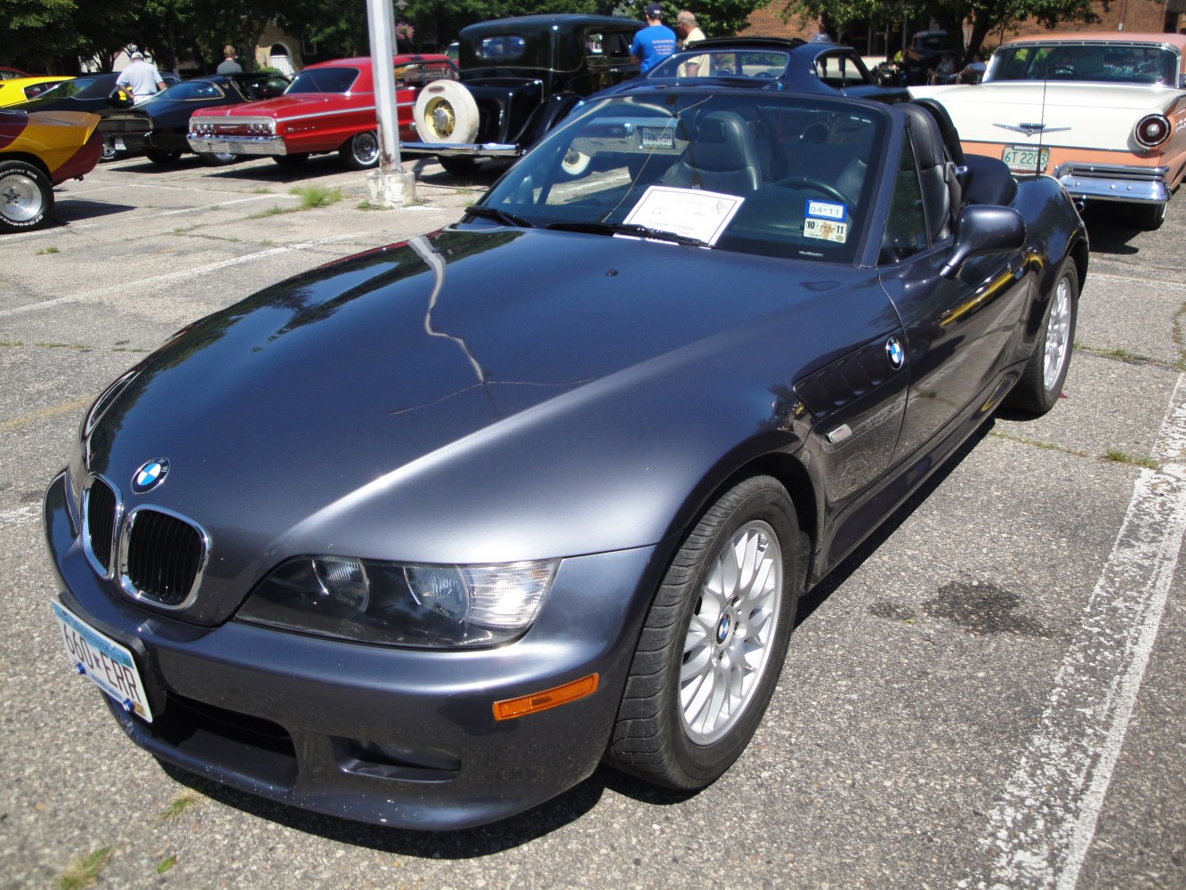 Front close-up of classic roadster grille and headlights