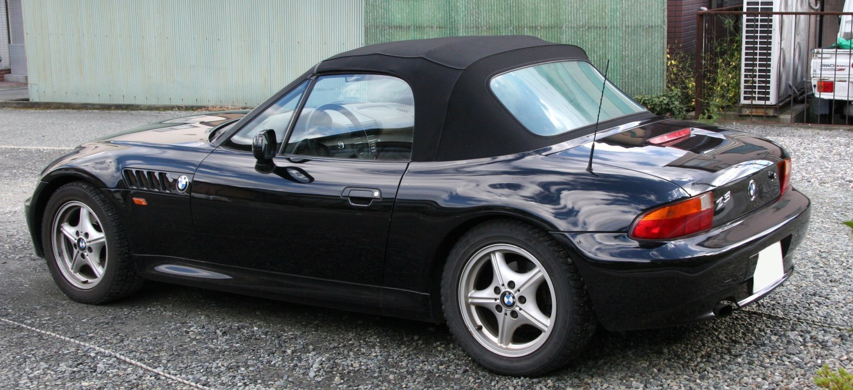 Black convertible with soft fabric roof and alloy five-spoke wheels