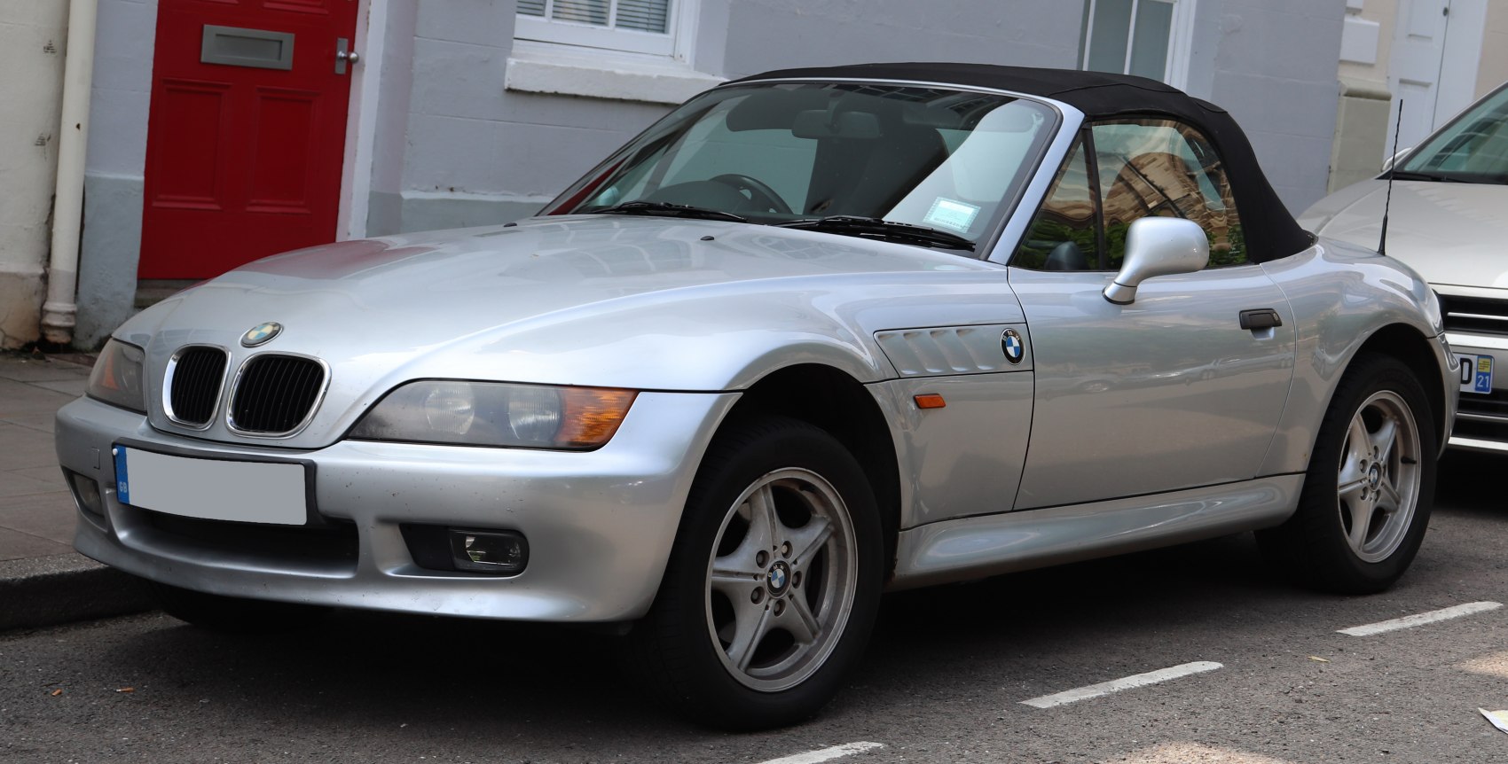 Silver convertible roadster with soft top and sporty alloy wheels