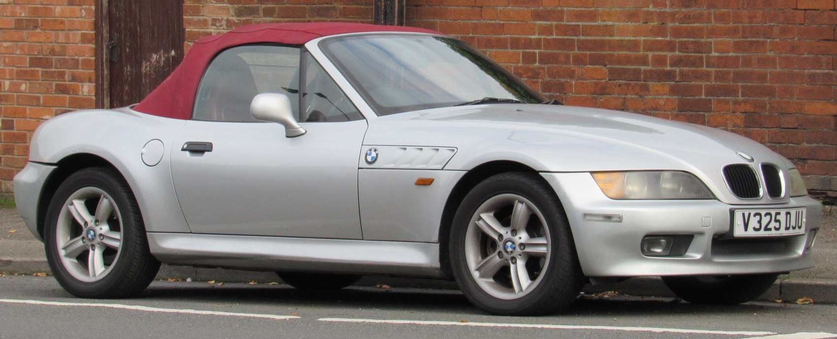 Convertible roadster with a soft top and alloy wheels