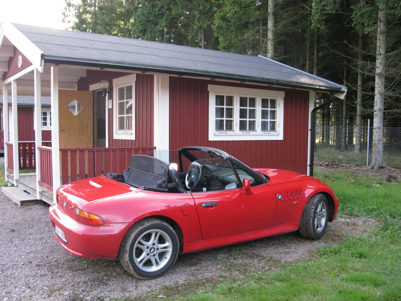 Red convertible roadster with sporty design and alloy wheels