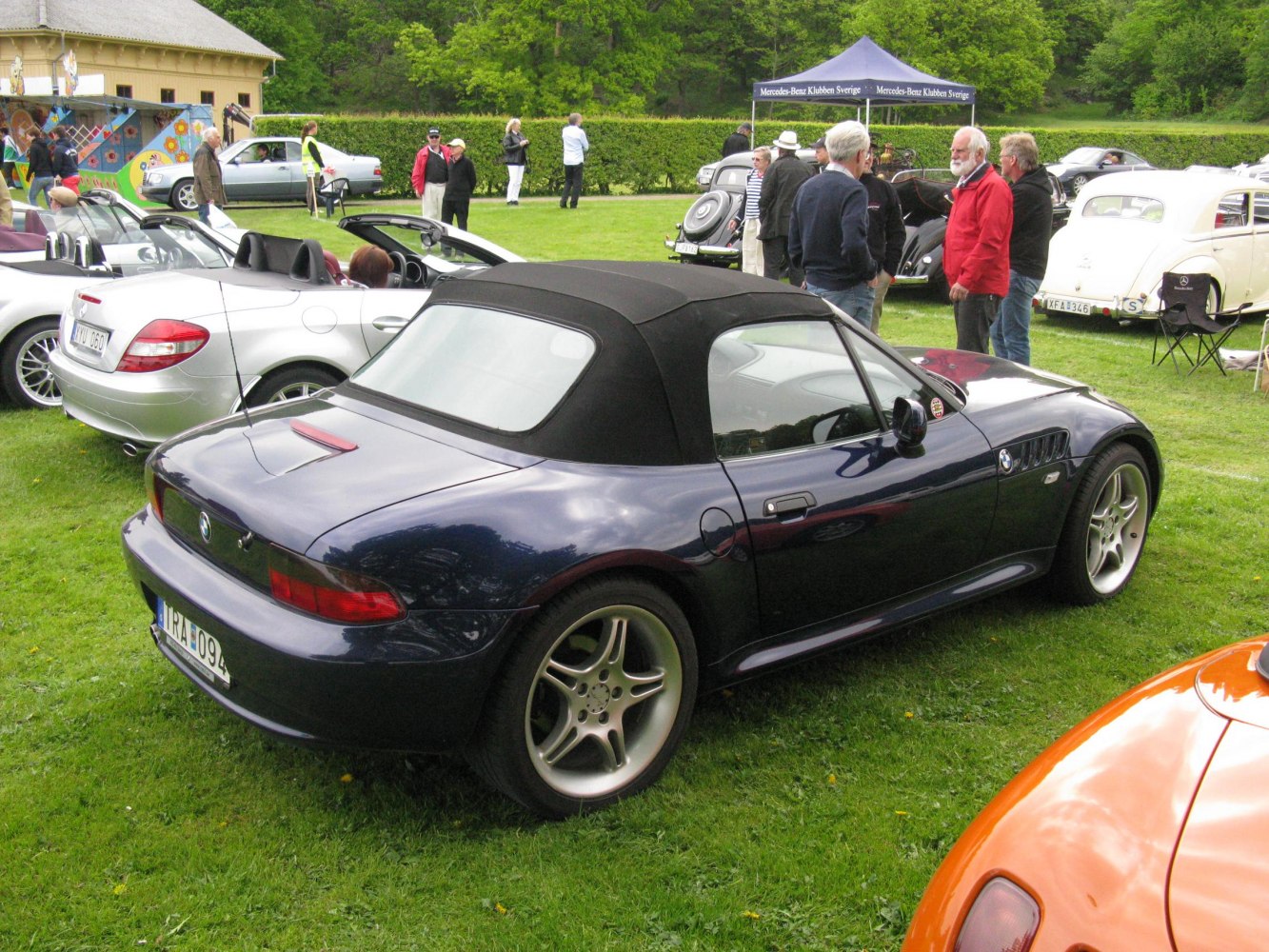 Dark blue roadster convertible with black soft top