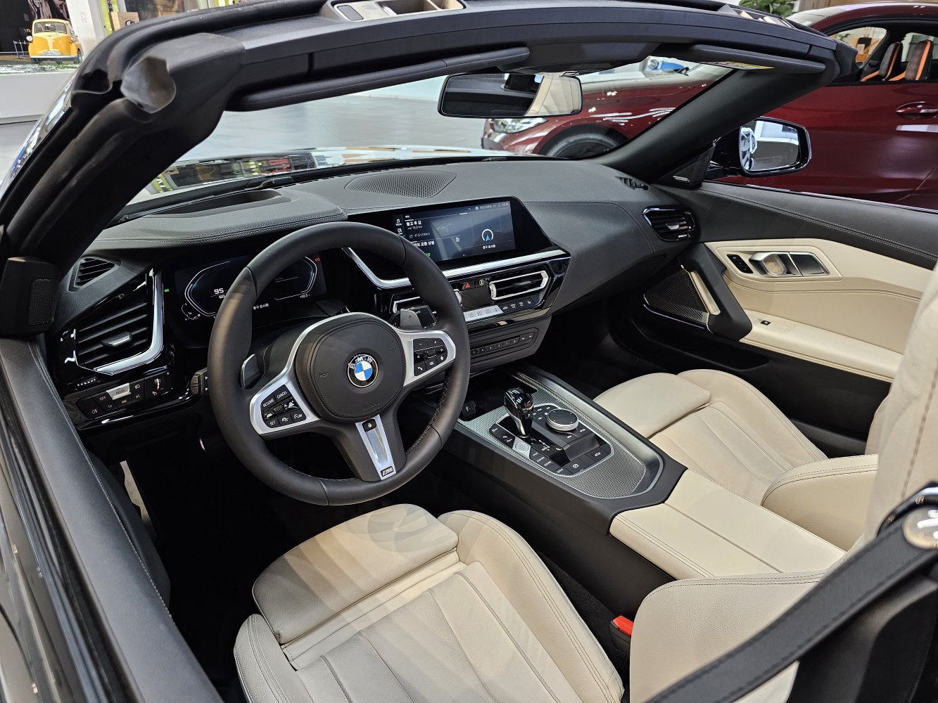 Digital dashboard and multifunction steering wheel in luxury convertible interior