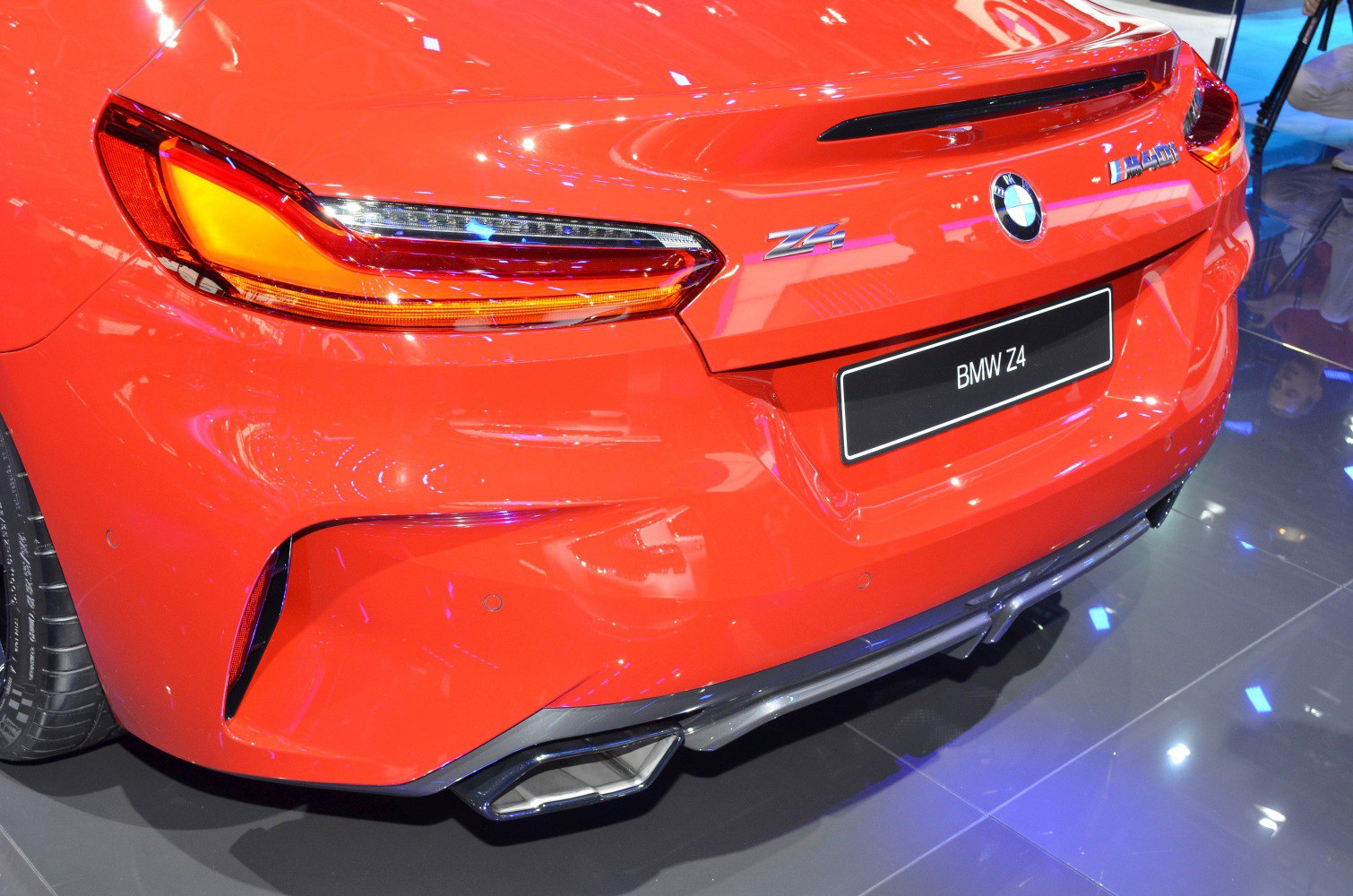 Rear taillights and dual exhaust of a sports car