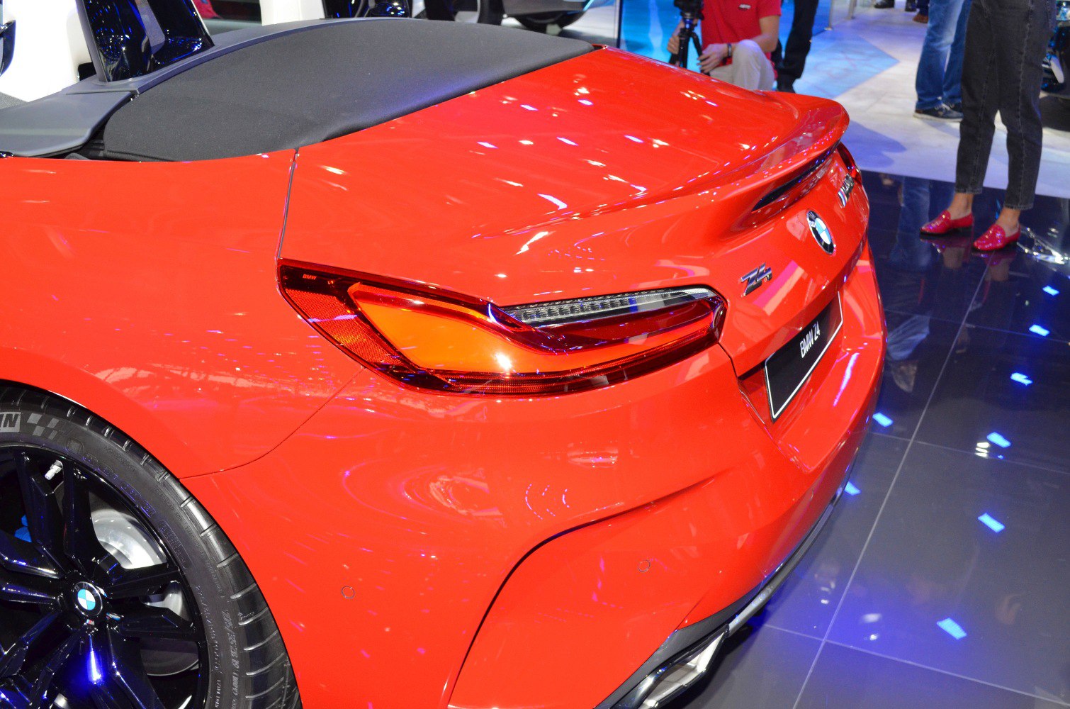 Close-up of sleek rear taillight and sporty rear design with black wheel and exhaust tip.
