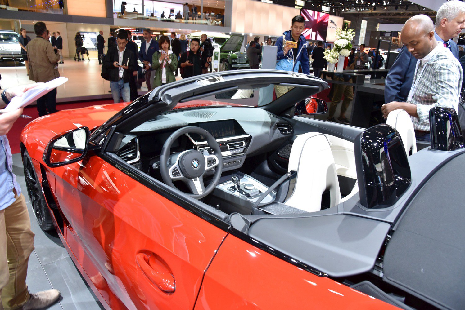 Convertible roadster with red exterior and white interior seats