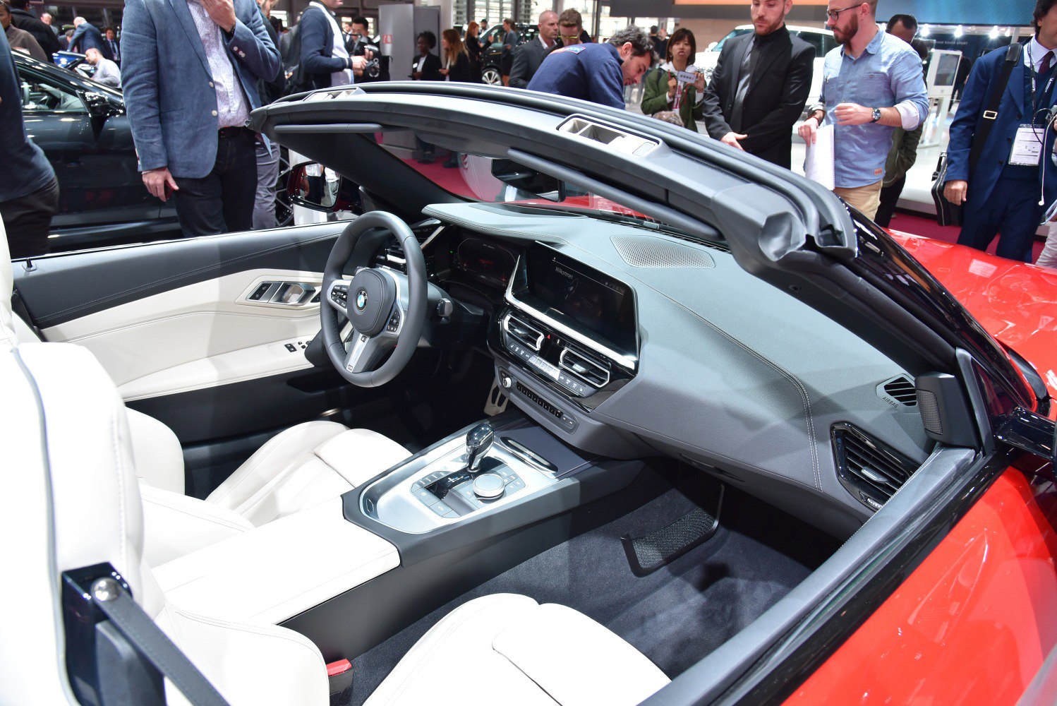 Modern convertible interior with digital dashboard and sporty steering wheel