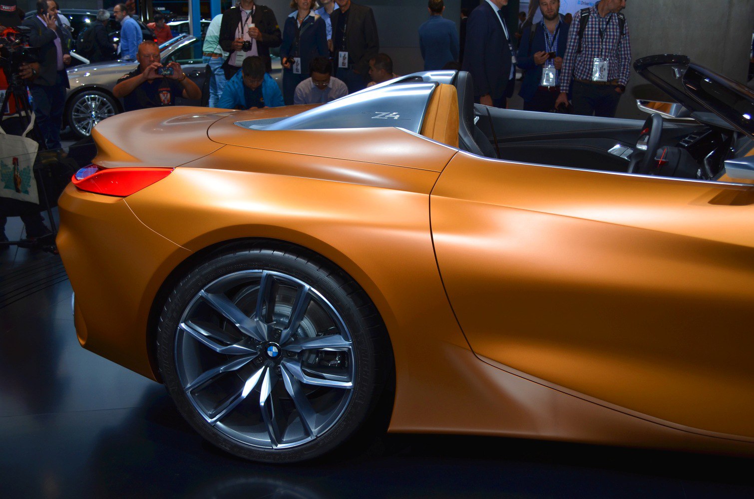 Rear side view and alloy wheel of a sleek convertible roadster