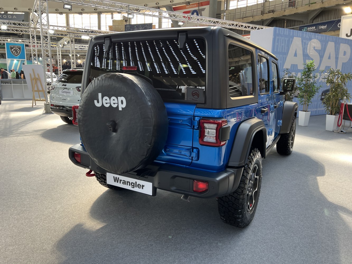 Rear view of SUV with spare tire cover and off-road tires