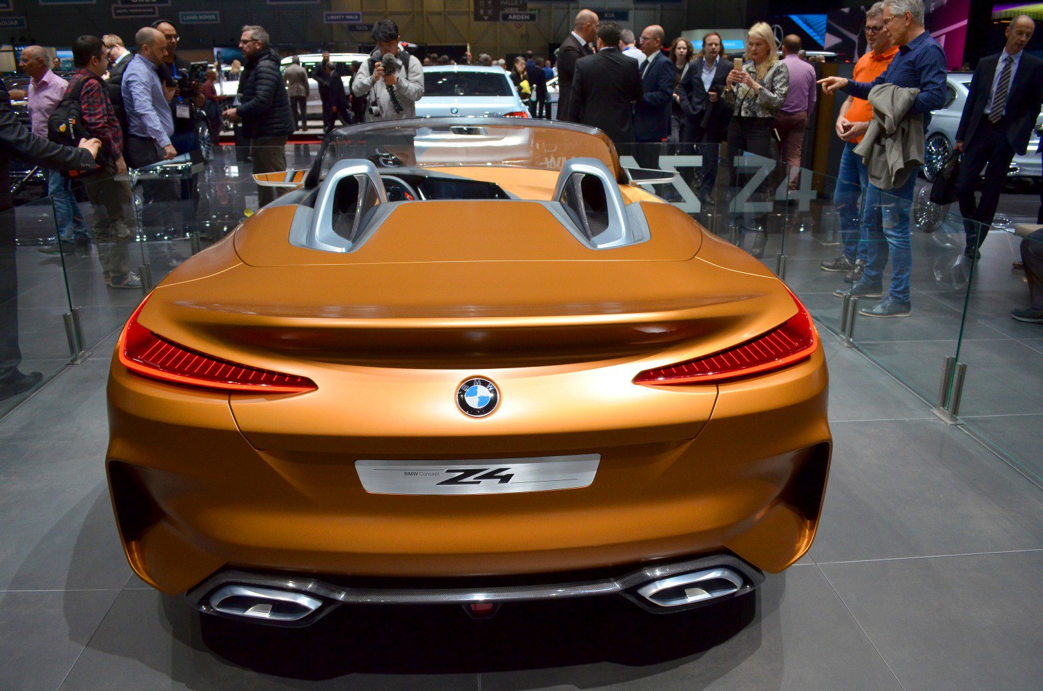 Rear view of sporty convertible with LED tail lights and dual exhausts