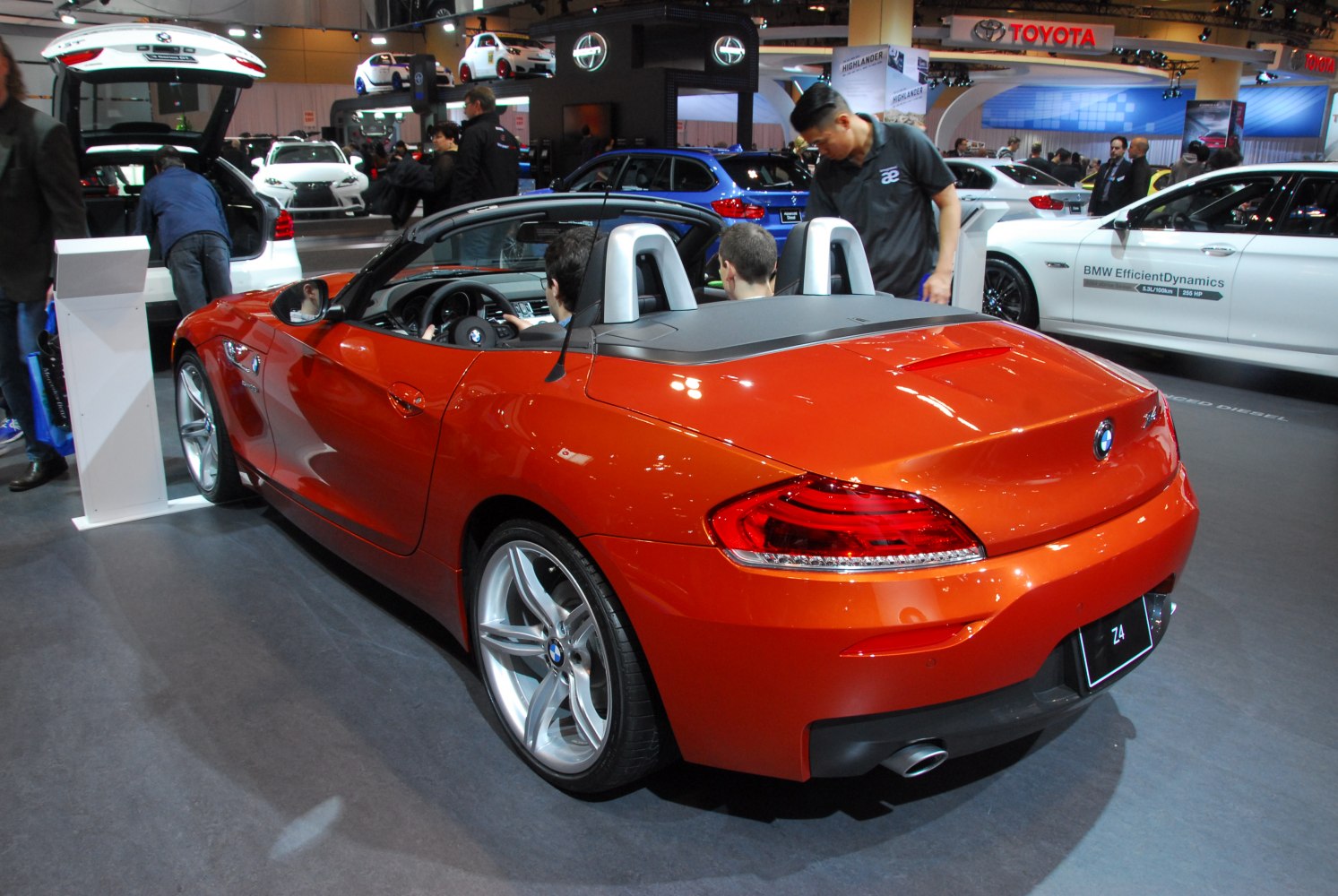 Convertible sports car rear with taillights and dual exhaust