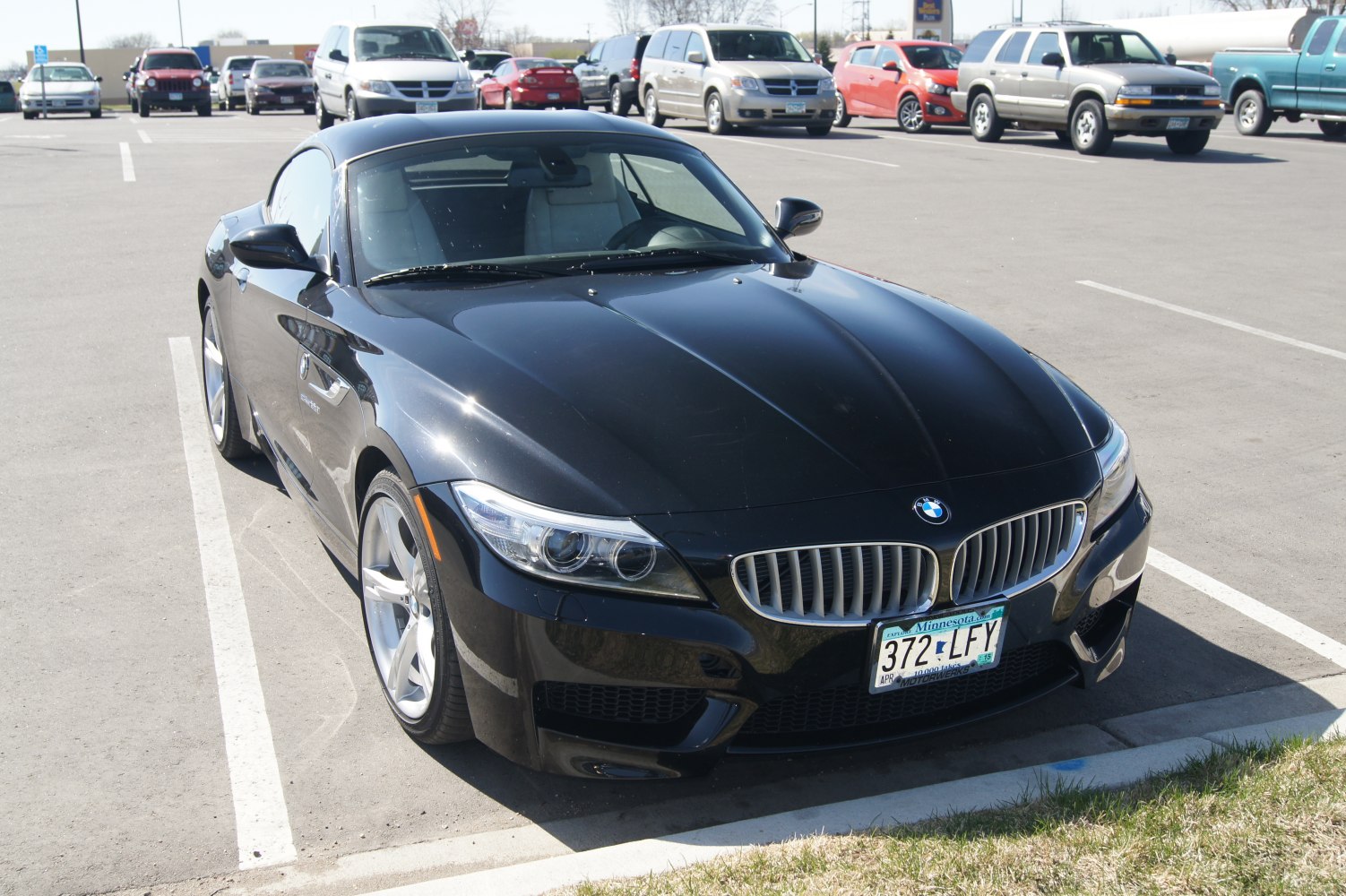 Black sports coupe with kidney grille and modern headlights