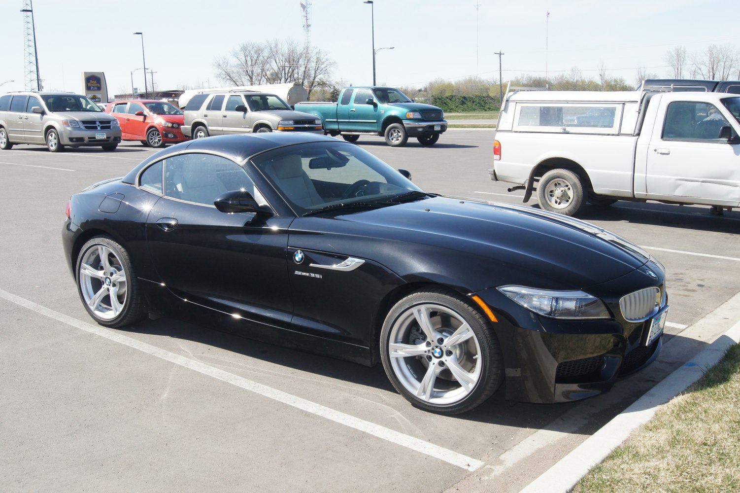 Black sporty coupe with hardtop and alloy wheels