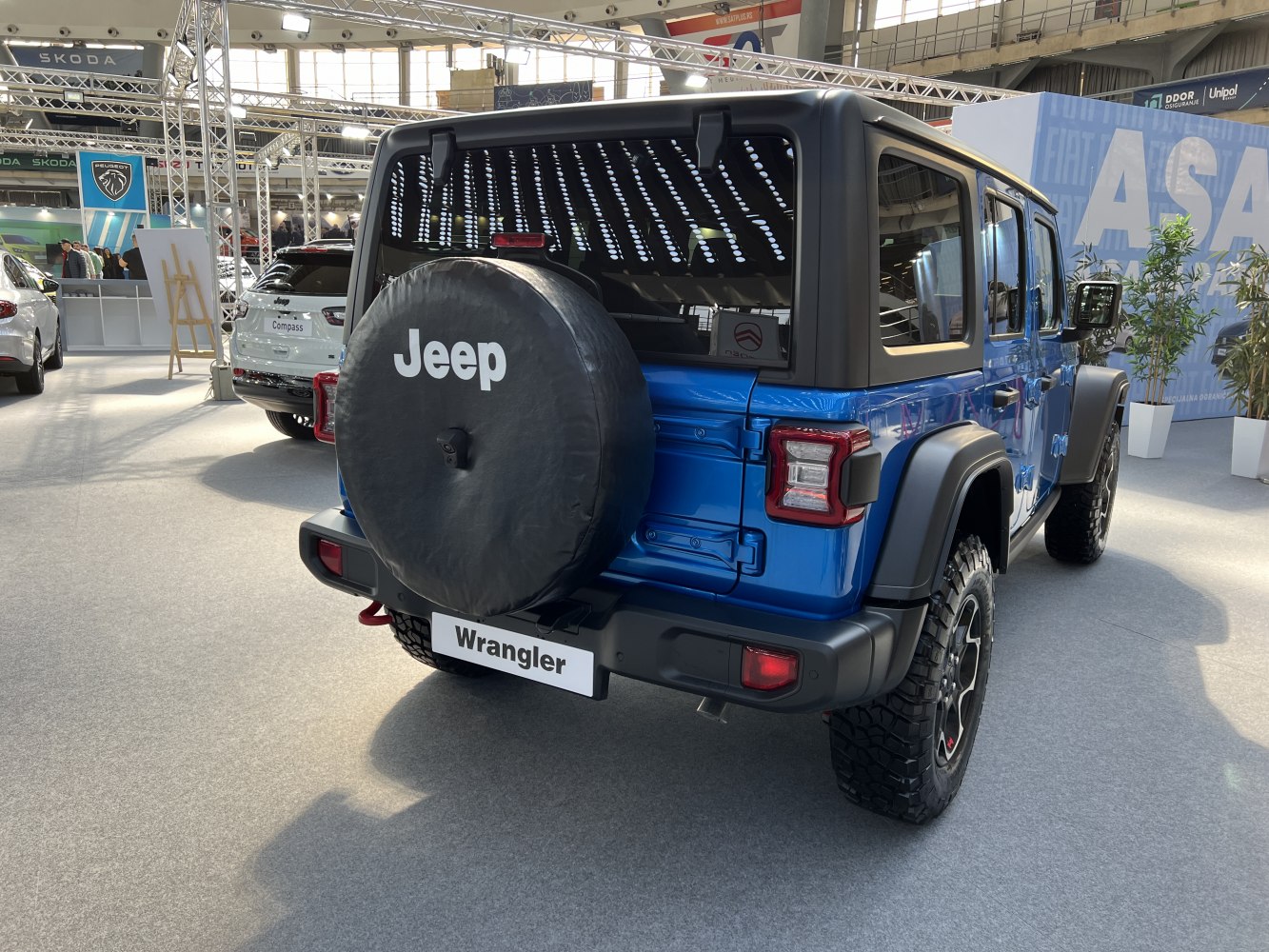 Rear view of off-road SUV with spare tire cover and rugged tires