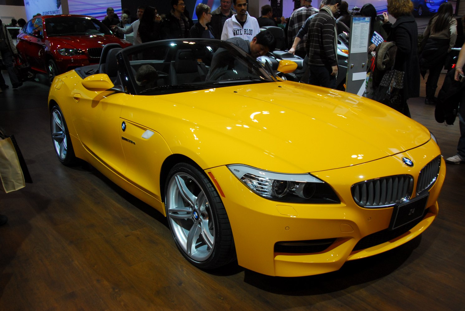 Yellow convertible sports car with sleek headlights and alloy wheels