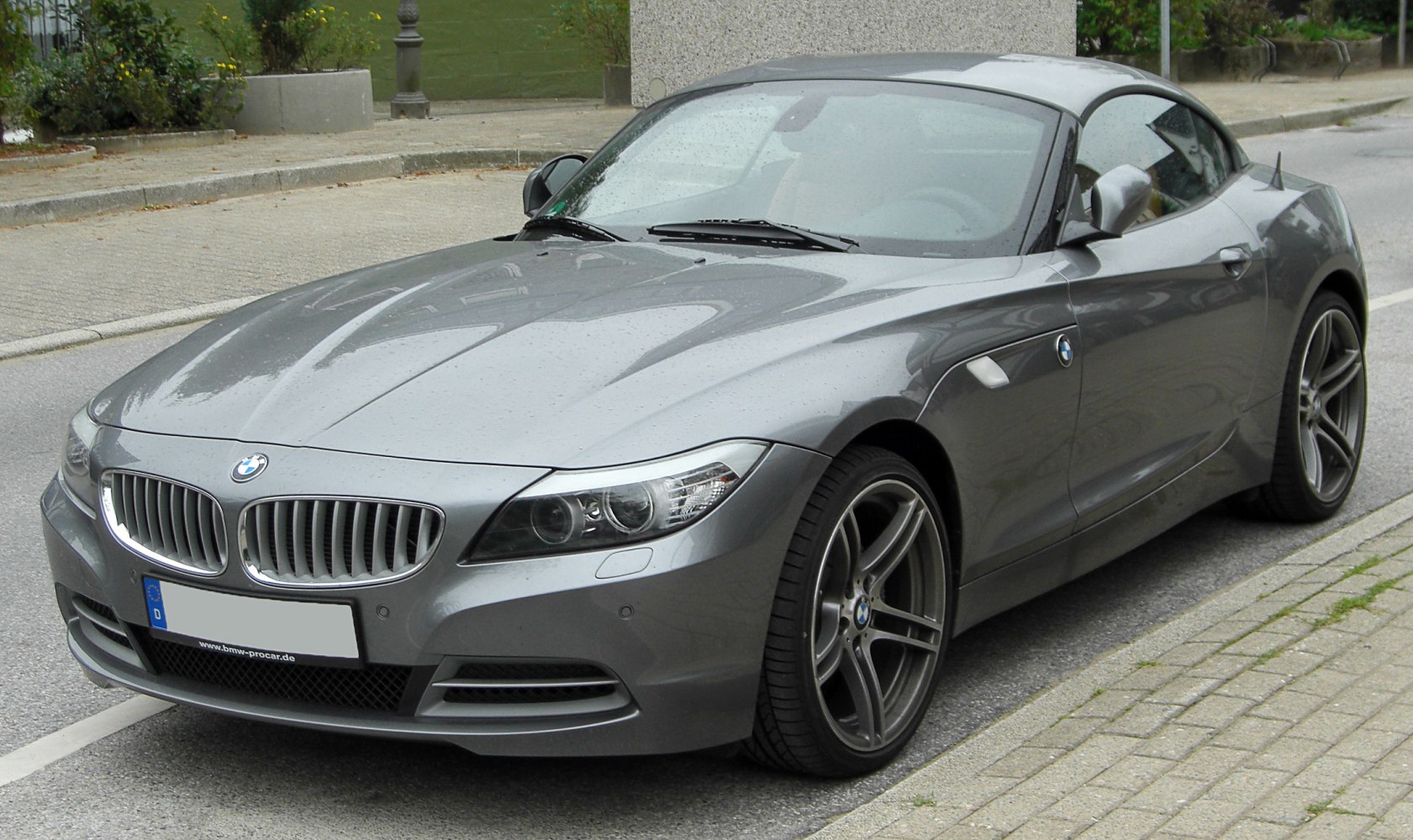 Front three-quarter view of BMW Z4 coupe with sleek headlights and alloy wheels