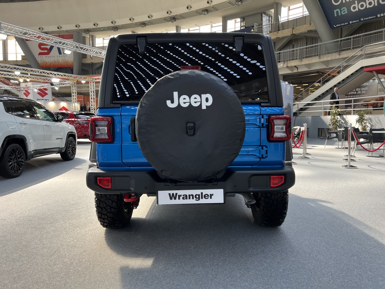 Rear view of SUV with spare tire cover and off-road tires
