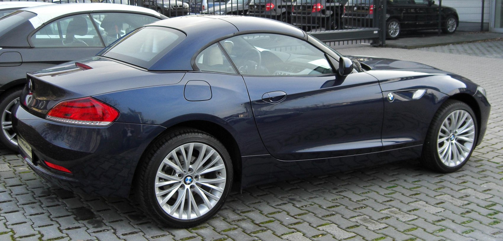 Rear and side view of a coupe with alloy wheels