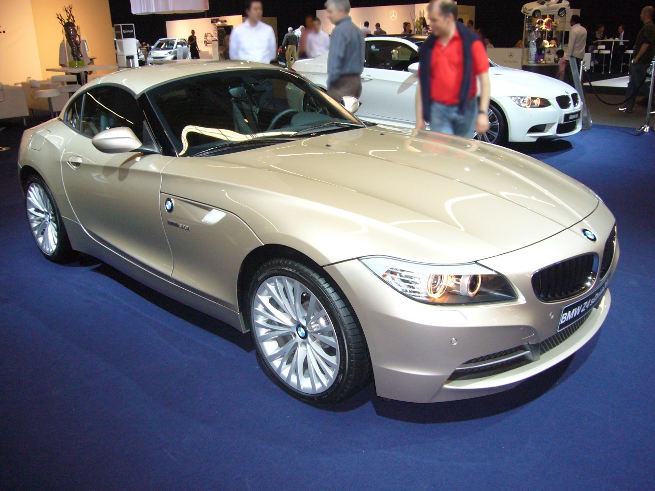Sporty coupe with unique headlights and multi-spoke alloy wheels