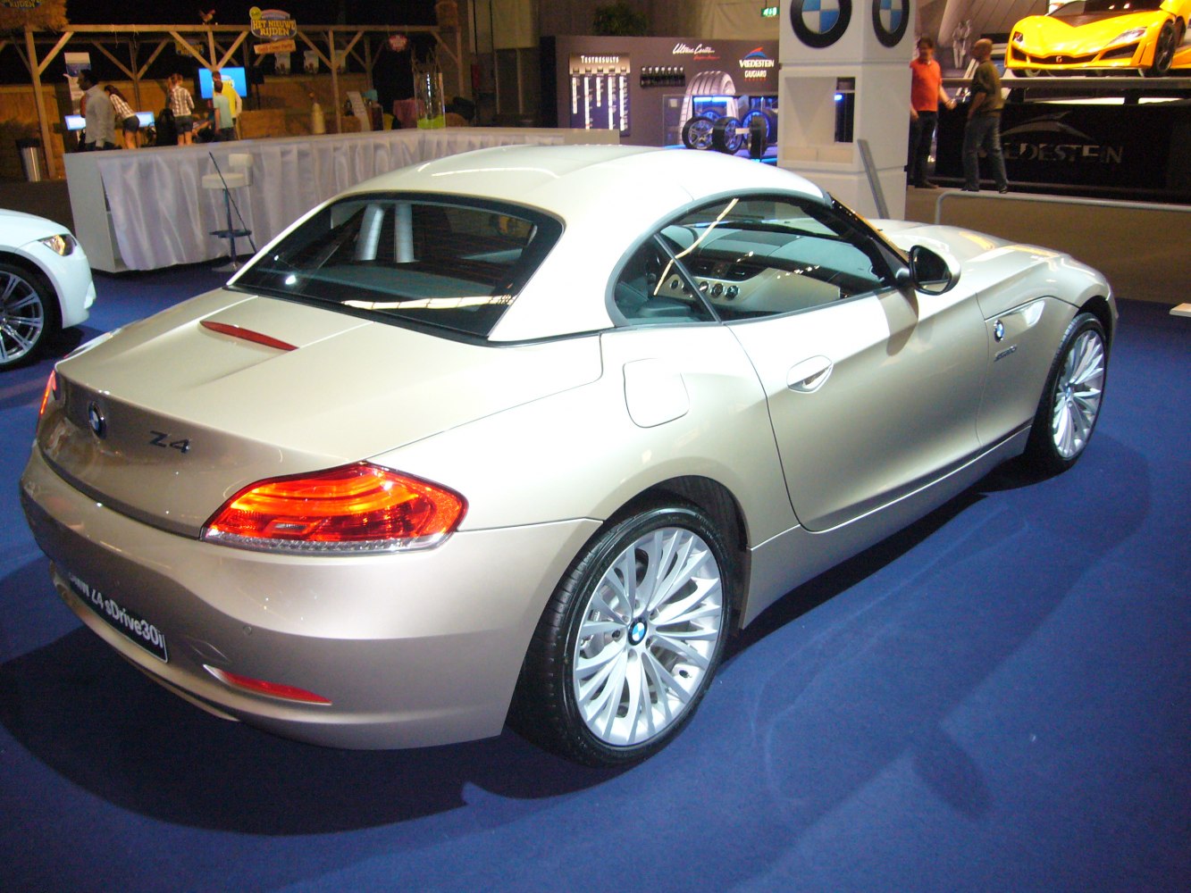 Rear view of hardtop convertible with taillights and alloy wheels