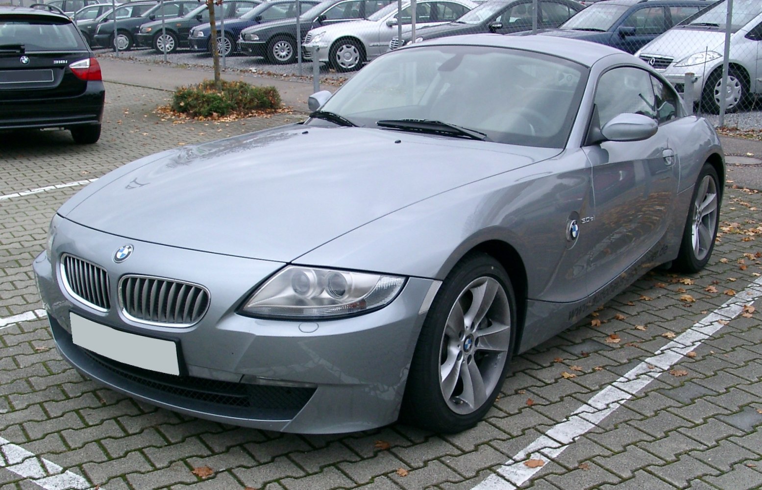 Silver coupe with kidney grille and sleek headlights