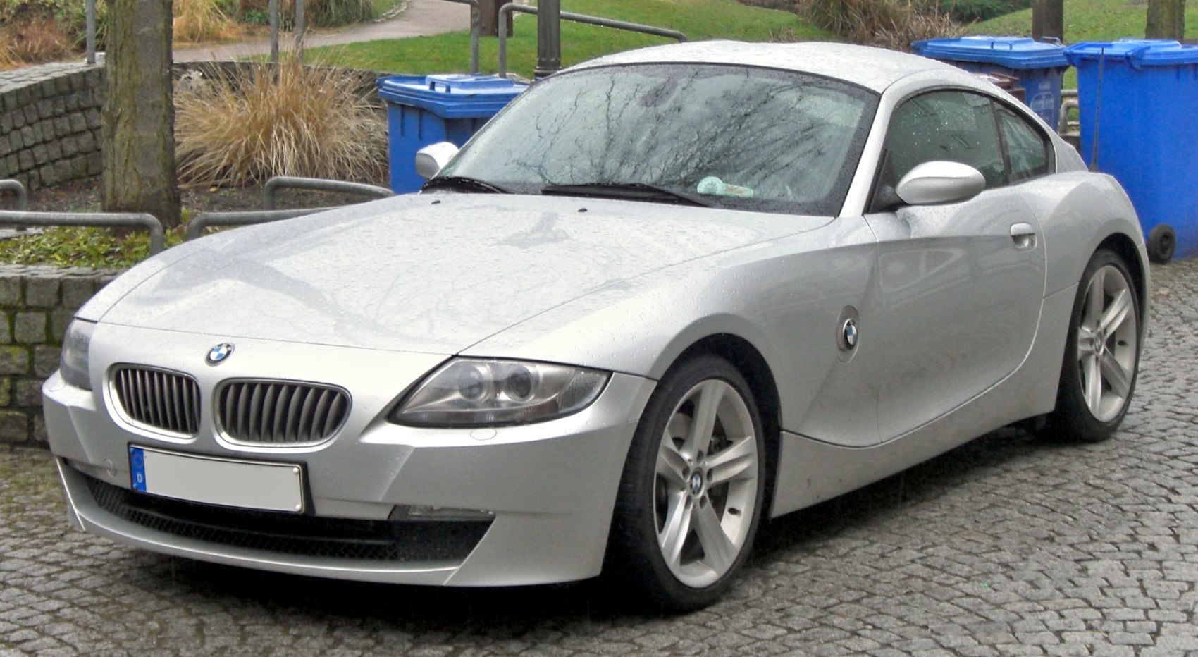 Silver sporty coupe with kidney grille and sleek profile